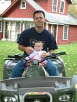 Olivia riding her 1st ATV